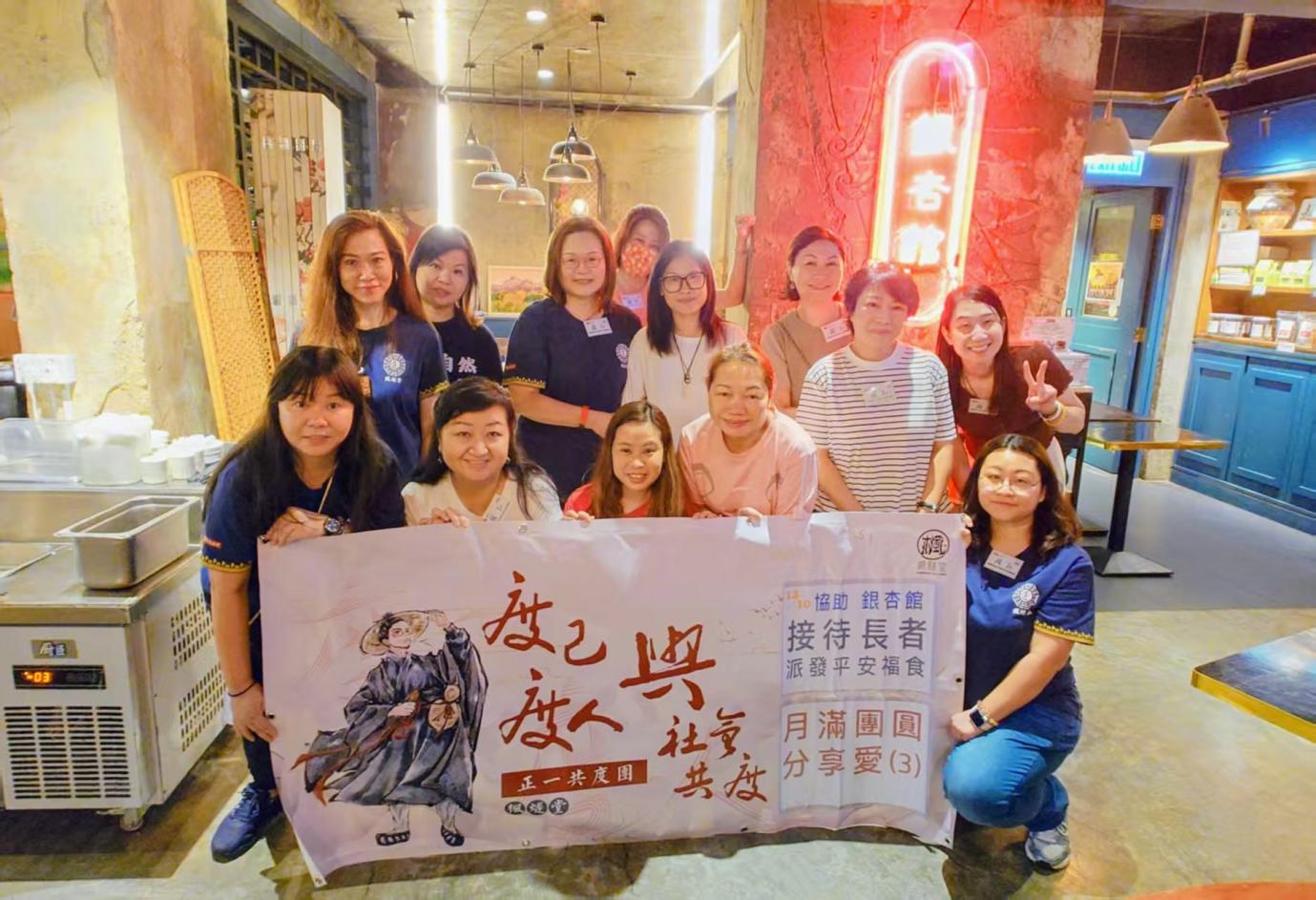 A group of women holding a banner
AI-generated content may be incorrect.